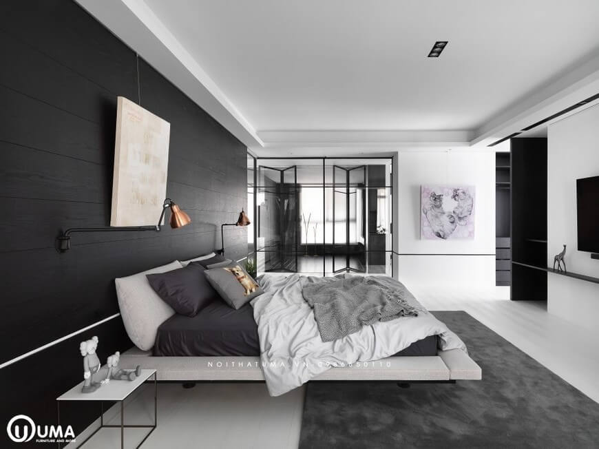 Giường ngủ được thiết kế với phong cách hiện đại, đặt trên chiếc thảm nhung màu xám đen